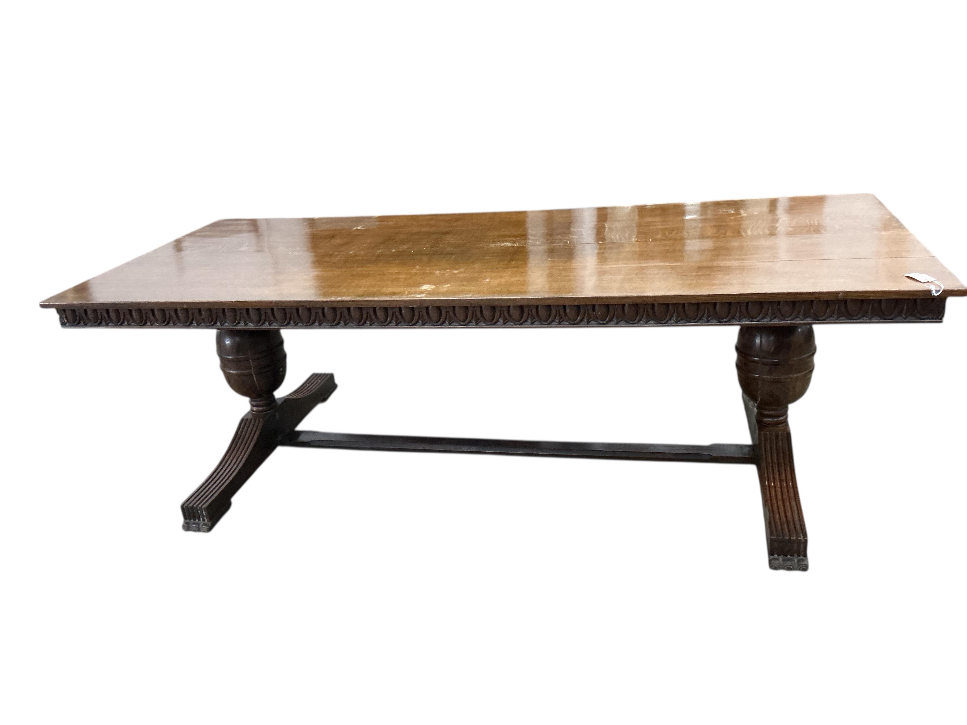 An 18th century style rectangular oak refectory dining table, width 243cm, depth 103cm, height 76cm